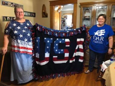 The Desire Tobey Sears members tied fleece blankets for veterans.