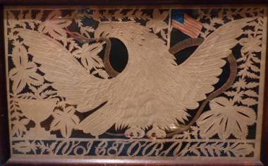 In the twenty-first century, we marvel at these intricate hand-cut pictures, called papyrotamia, but in 19th-century America, many had mastered this skill. The bald eagle with widespread wings has long been one of the most revered patriotic images. Here with the nation’s flag in the background, the eagle grasps a snake in his beak. The letters across the lower border spell "VICTORY."
