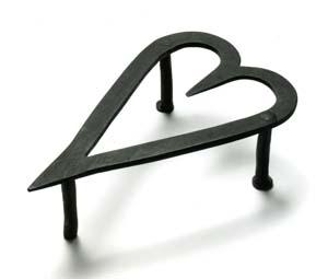 This trivet was made in the 19th century, possibly in Pennsylvania. The heart shape was a popular design in nineteenth-century domestic ironware.