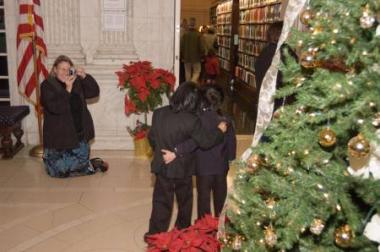 The beautifully decorated Christmas tree in the Pennsylvania Foyer was an ideal spot for family photos.