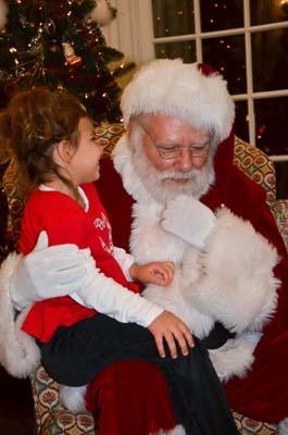Santa stopped by the Open House to hear requests from young visitors.