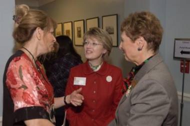 First Vice President General Merry Ann Wright (right) and Library General Polly Bartow (center) talk with guests outside the Museum Gallery.
