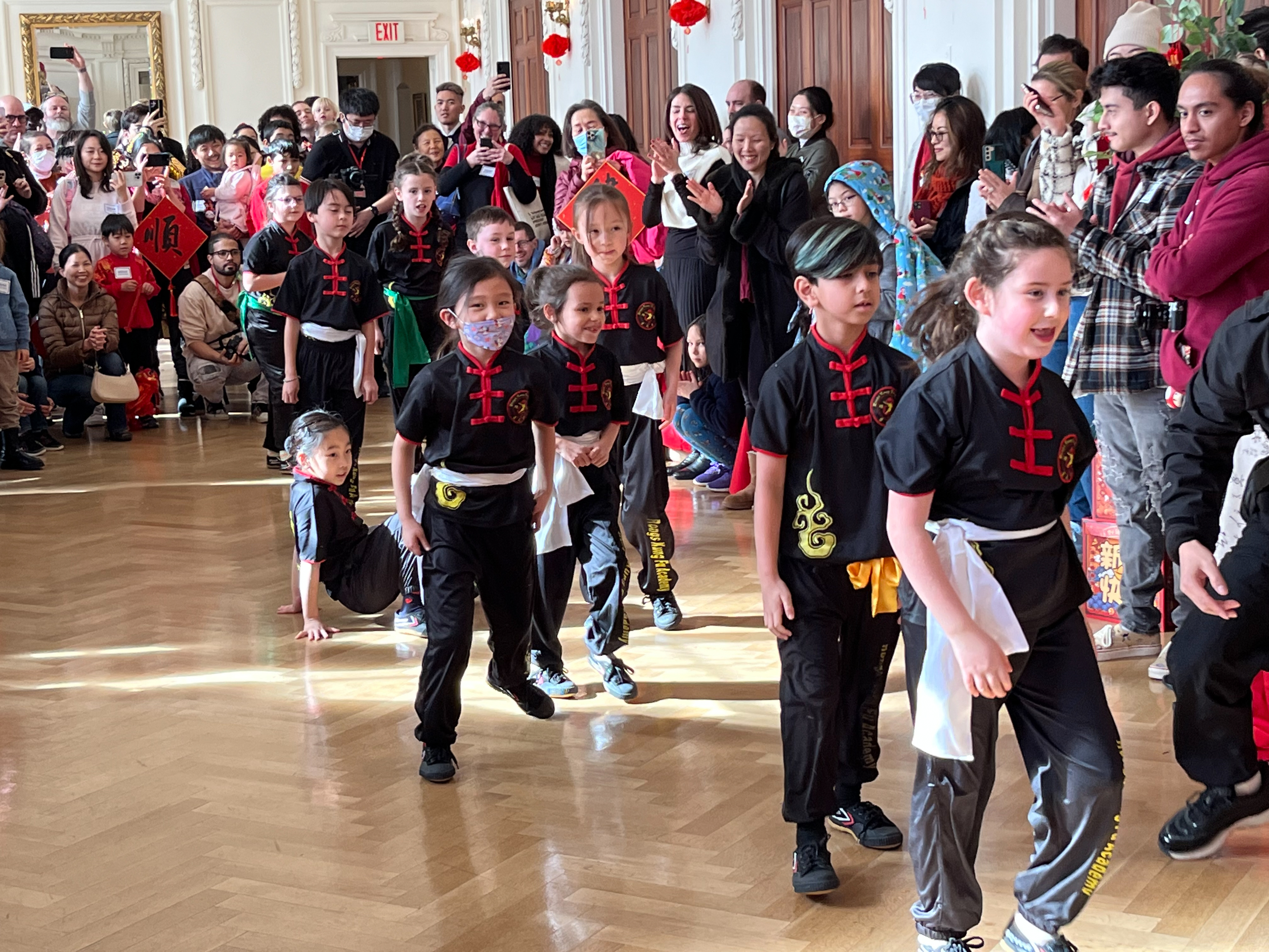 Kids parading through O'Byrne Gallery for Lunar New Year Festivities