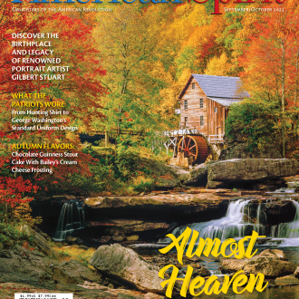 American Spirit cover with woods and mill on waterfall. 