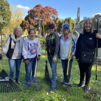 DAR members volunteering clean up cemetery