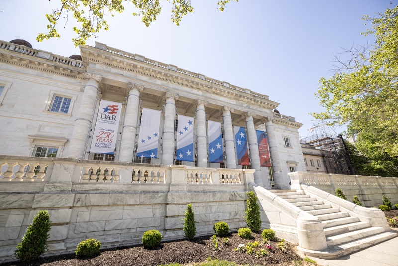 Banners on the side of the DAR Building highlighting America's 250th