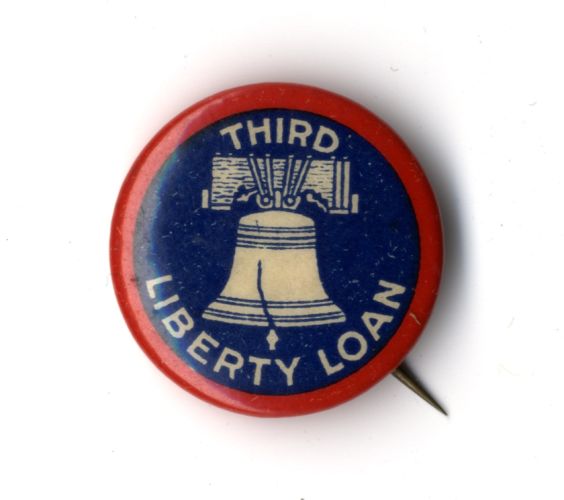 Navy blue liberty loan pin with red rim, image of the Liberty Bell, and lettering: “Third Liberty Loan,” circa 1918.
