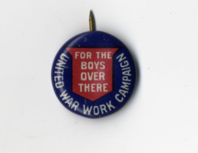 Navy blue liberty loan pin with red bell and lettering: “For the Boys over There: United War Work Campaign,” circa 1918.