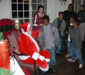 Children eagerly await their chance to tell Santa their Christmas wishes.