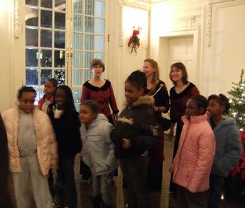 A group of children dance and sing along to their favorite carols being sung by Seraphim.