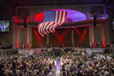 The Flag of the United States of America billows from the ceiling of Constitution Hall during the Opening Night Ceremony of the 123rd Continental Congress on Wednesday, June 25, 2014.