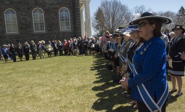 The large crowd, including many of the DAR Executive Board, gathers outside the Old Cadet Chapel for the wreath laying at the Margaret Corbin Monument.