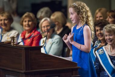 The national 5th grade winner of the DAR American History Essay Contest, Emma King, tells the audience “I’m super excited to be here” right before reading a portion of her winning essay.
