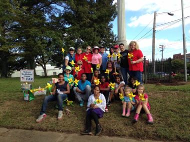 In Charlotte, NC, Daughters of the Mecklenburg Chapter, Clear Creek Militia Chapter, and Members of Christ Presbyterian Church gathered together to celebrate DAR's 125th Anniversary by planting 360 daffodil bulbs from the Daffodil Project in memory of children who died in the Holocaust, and clean up the sidewalk on a busy Charlotte street near one of our monuments. It was simply an awesome day!! Lots of hard work, great kids and incredible DAR daughters and HODARs!!