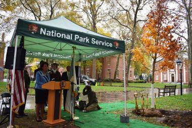 DAR First Vice President General Denise VanBuren speaking next to one of DAR’s trees in Independence National Historical Park.