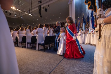 President General Pamela Wright walks on stage