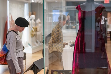 A member explores the DAR Museum and reads description of Marian Anderson display