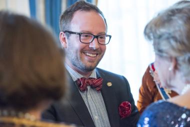 DAR Outstanding Teacher of American History Adam Hellebuyck is greeted in the President General’s Reception Room.