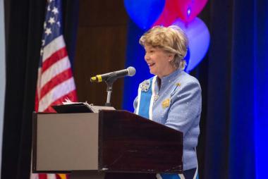 President General Ann Dillon welcomes members to Service to America Night held at the Grand Hyatt Hotel on June 28, 2019. In addition to celebrating the service accomplishments of the DAR membership, the evening kicked off the celebration of the Centennial of the 19th Amendment.