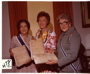 nations to the NSDAR Archives and Americana Collection are always welcome. This picture shows a member donating Revolutionary War documents to the collection in 1976.