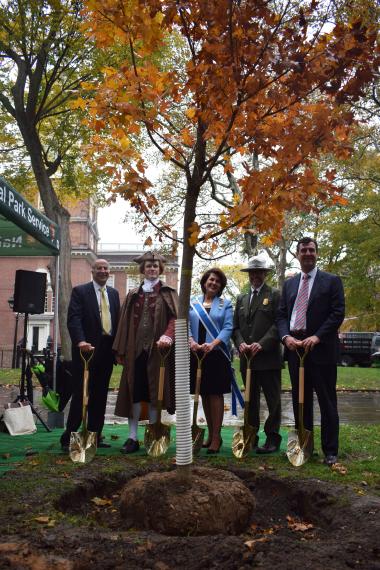 Mark Squilla, Philadelphia City Councilmember; Thomas Jefferson, principal author of the Declaration of Independence and 3rd President of the United States;  Denise Doring VanBuren, DAR First Vice President General; Patrick Suddath, Acting Superintendent of Independence National Historical Park; Andrew Hohns, USA250 Board Chair – standing with one of the 76 trees DAR will sponsor in Independence National Historical Park.