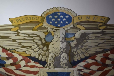 A close up look at the flag mural where you can see the dividing line down the eagle showing where the right side has been cleaned and the left side is still in need of cleaning from the dirt and other elements had built up over the years.