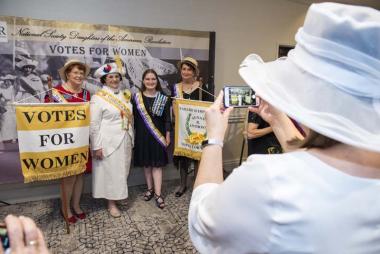 DAR members enjoyed a suffrage themed photo booth set up by the Commemorate Events Committee during the Service to America Night event.