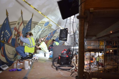 Here you can see work being done on the canvas mural paintings on two levels of the scaffolding – the flag mural in the dome and the state names in the cornice below the dome.
