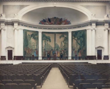 When the DAR Constitution Hall auditorium first opened in 1929, it featured a pale palette that highlighted the colorful canvas flag mural in the dome above the stage and a decorative four-panel curtain painted with historic American Revolution era scenes.