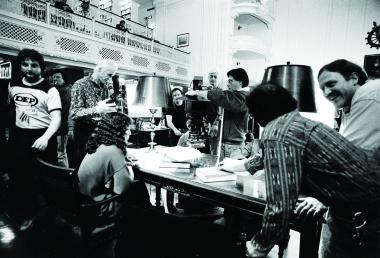 Academy Award-winning actress, singer, songwriter and director Cher, seated at left, gets into character as cast and crew prepare to shoot a scene filmed in the DAR Library for the movie “Suspect” which was released in 1987.