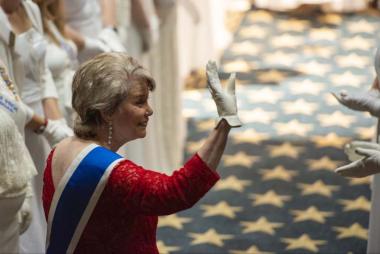 President General Ann Dillon greets members during as she enters the Constitution Hall auditorium during the Opening Night procession.
