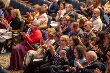 Audience clapping. 