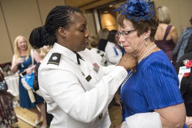 The DAR is a proud Commemorative Partner of the U.S. Vietnam War Commemoration and representatives joined at Service to America Night to provide more information about the Commemoration and to honor Vietnam veterans. Vietnam War Commemoration representative  LTC Nicole Hayes performs an emotional pinning ceremony on a DAR member who served during the Vietnam War. The Vietnam Veteran Lapel Pin is presented to veterans as a lasting memento of the nation’s thanks. www.vietnamwar50th.com