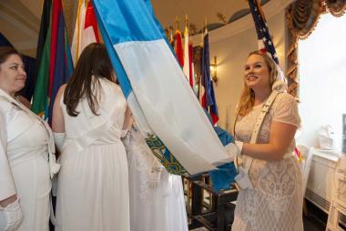 DAR Pages prepare for the procession of state flags that opens the gala ceremony.