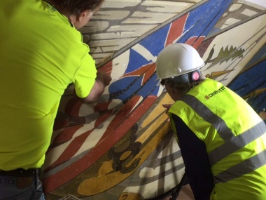 President General Dillon getting an update on the flag mural conservation.