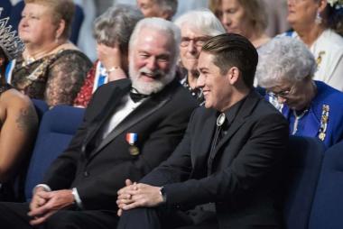 The National Outstanding Veteran Volunteer, David Stokes, and the National Outstanding Youth Volunteer, Andrew Fancher, enjoy a moment together during the National Defense Night Ceremony.