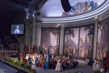 In the final evening ceremony of her administration, President General Ann Dillon concludes the National Defense Night Ceremony with the backdrop of the restored DAR Constitution Hall stage behind her that DAR members helped to bring back to its historical grandeur during her administration.