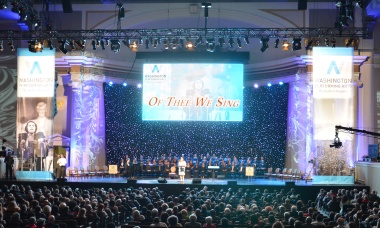 April 12, 2014 - WPA President & CEO Jenny Bilfield welcomes the audience and thanks supporters and partners including recognizing President General Lynn Young and the enthusiastic support of the Daughters of the American Revolution on the "Of Thee We Sing" celebration concert.