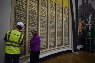 Here you can see the existing acoustic panels and in the background the beginnings of the installation of the painted mural screen being installed over the panels.