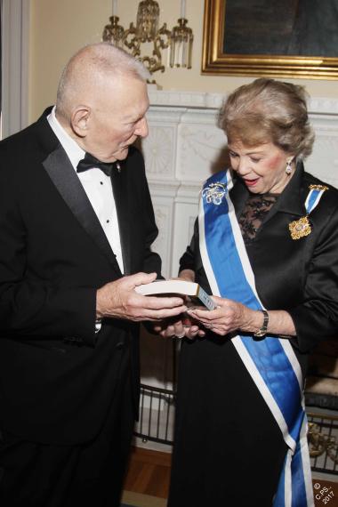 Opening Night keynote speaker and DAR Medal of Honor recipient, Gene Kranz, former NASA Flight Director, presents DAR President General Ann Dillon, with his a signed copy of his autobiography “Failure is Not An Option.”