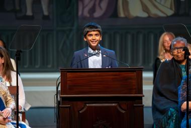 A kid giving speech on his essay