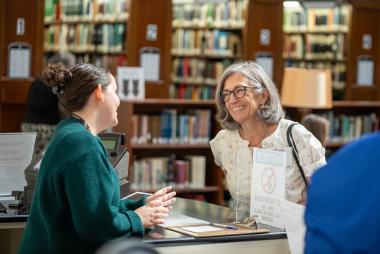 Woman speaking to Library Help Desk 