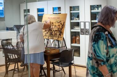 Woman interacts with Museum experience