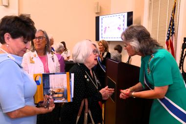 Exec speaks to member at a forum