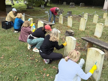 Members restored plaques and monuments