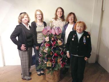 Members of the Old White House-General Frelinghuysen-Colonel Lowrey Chapter in New Jersey created an entry for the Festival of Trees fundraiser sponsored by the Red Mill Museum, a historic mill museum in Clinton, New Jersey. Over the years, local organizations, business and individuals have made this event a success by decorating and donating trees and wreaths to be part of a silent auction. All proceeds go to support the Museum, a non-profit organization. This donation serves several purposes: it gives the