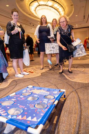Woman plays corn hole