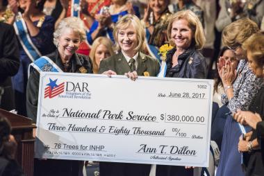 DAR President General Ann Dillon and Honorary President General Ann Dillon present a donation to the National Park Service, accepted by Cynthia MacLeod, NPS Northeast Regional Director, to sponsor the purchase, planting and ongoing care of 76 trees in Independence National Historical Park. The gift was the first major, patriotic gift to the nation in honor of the upcoming 250th anniversary of the United States in 2026. www.dar.org/America250 