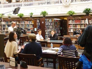 The production team prepares to shoot the scene with Rob Lowe and the independent genealogist Josh Taylor.