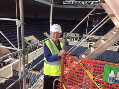 President General Ann Dillon climbs the scaffolding for inspection of the work. She has said that getting to see a close up view of the decorative features of the Constitution Hall at 40 feet above the stage has been one of the highlights of serving as President General. 